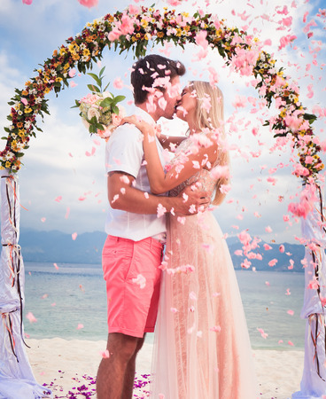 wedding couple just married with bridal bouquetの写真素材