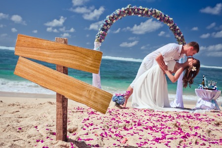 wedding couple just married near the beach at Bali with copy space for textの写真素材