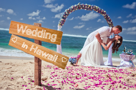 wedding couple just married near the beach at Hawaii with copy space for textの写真素材