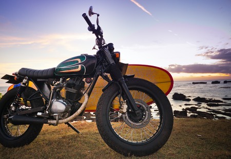 Motorcycle with surfboard at outdoors, Indonesian cultureの写真素材