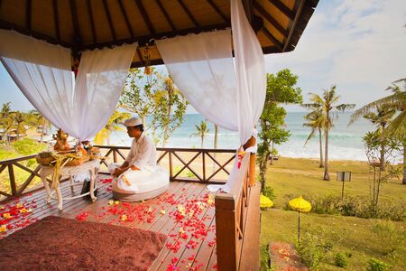 balinese wedding ceremony with flowers backgroundの写真素材