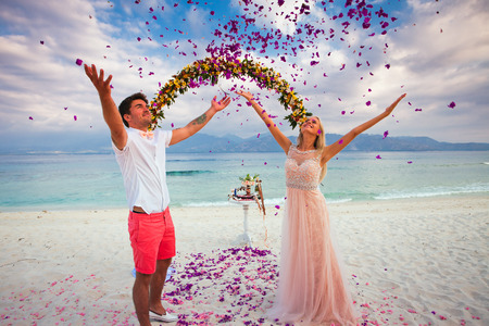 wedding couple just married near the beach at Baliの写真素材