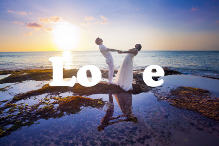 wedding couple just married near the beach with love textの写真素材