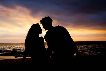 First date of a couple at background silhouetteの写真素材