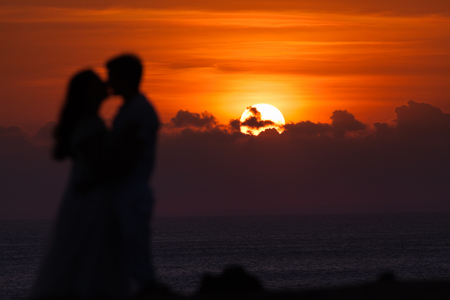 First date of a couple at background silhouetteの写真素材