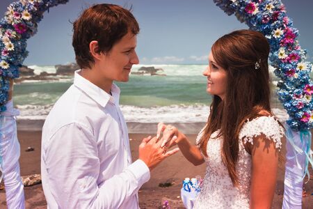young man makes a proposal to his girlfriendの写真素材