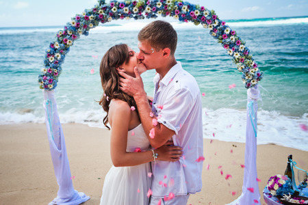 wedding couple just married near the beach at Baliの写真素材
