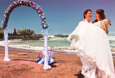 wedding couple just married near the beach at Baliの写真素材