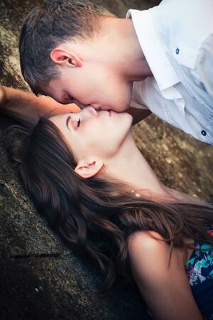 Loving couple at background of wallの写真素材