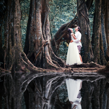 wedding couple in mysterious fairy forestの写真素材