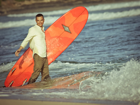concept of office businessman with surf near the oceanの写真素材