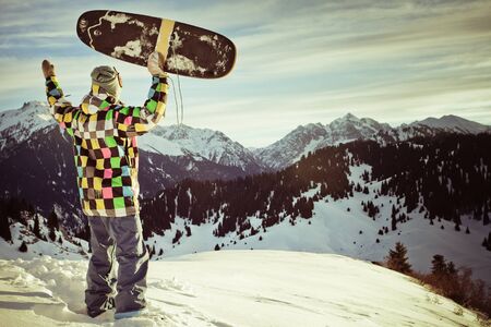 image with snowboarder with a hat on the background of high snowy mountain Alps in Grindelwald, Swissの写真素材
