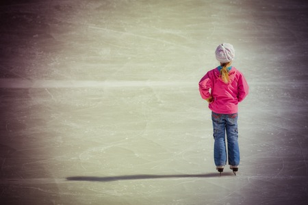Image of young girl who are ice skating at the ice rink outdoors at Canadaの写真素材