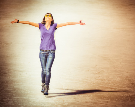 successful young woman skating at the Medeo, Almaty in Kazakhstanの写真素材