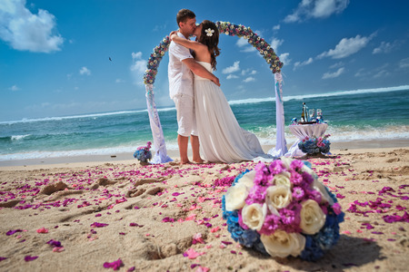 wedding couple just married near the beach at Baliの写真素材
