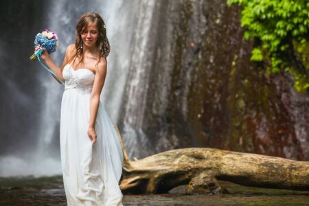 Bride with wedding bouquet, Baliの写真素材