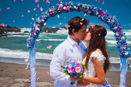 wedding couple just married near the beach at Baliの写真素材