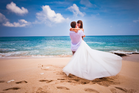 wedding couple just married at the beach