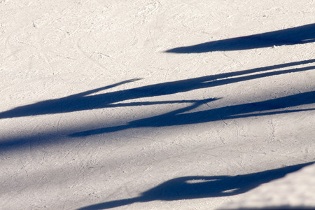 shadow background of group of teenagers on ice holding hands at the Medeoの写真素材