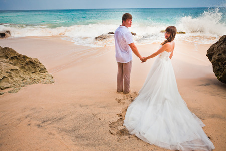 wedding couple just married at the beachの写真素材