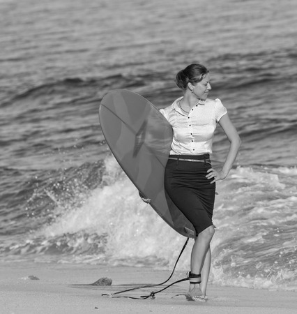 concept of office businesswoman with surf near the oceanの写真素材