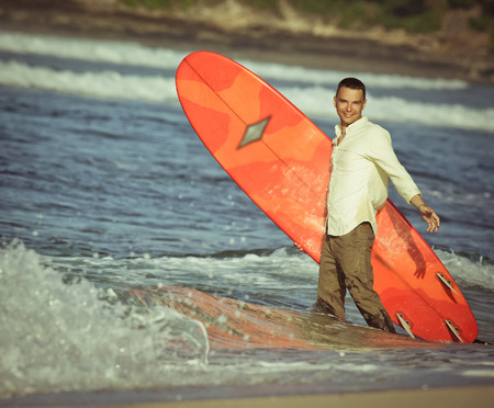 concept of office businessman with surf near the oceanの写真素材