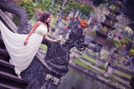 bride in park in Bali, she is looking for her husbandの写真素材