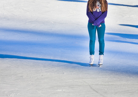 Image of young girl who are ice skating at the ice rink outdoors at Medeoの写真素材
