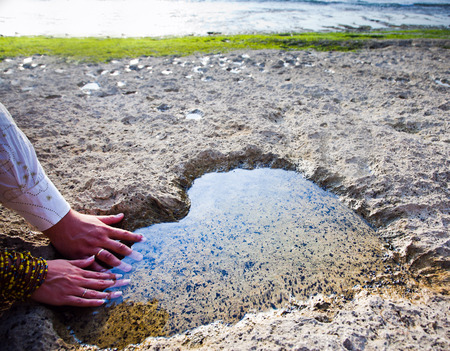love concept of hands at beach heartの写真素材