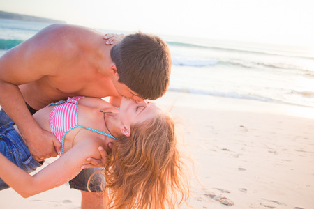 wedding couple just kissing at Balinese beachの写真素材