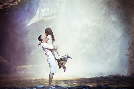 retro revival photo of couple travels to balinese waterfallの写真素材