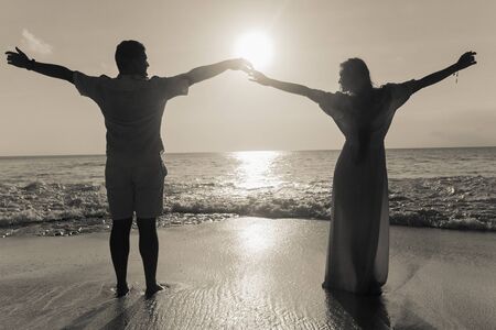 retro photo of honeymoon couple resting at beachの写真素材