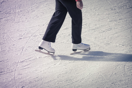 Image of adult who are ice skating at the ice rink outdoors at Medeoの写真素材