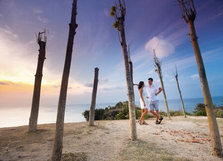 honeymoon couple at blue beach and sky backgroundの写真素材