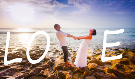 wedding couple just married near the beach with love textの写真素材