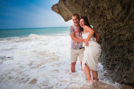 Happy couple at the coast of Bali islandの写真素材