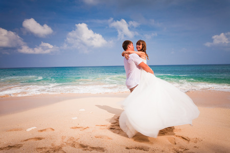 wedding couple just married at the beachの写真素材