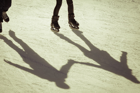 shadow background of friendship people on the ice holding hands, retro revivalの写真素材