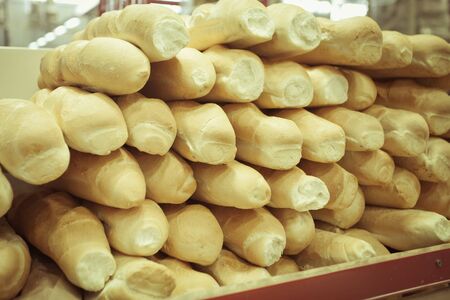 background of bread - French baguette at supermarketの写真素材