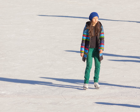 Young girl at the ice rink outdoor at Medeo, Almaty, Kazakhstanの写真素材