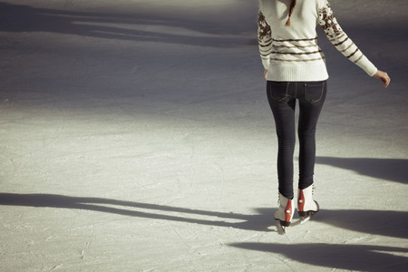Image of young girl who are ice skating at the ice rink outdoors at Medeoの写真素材