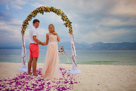 wedding couple just married near the beach at Baliの写真素材