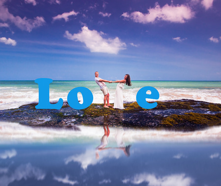 wedding couple just married near the beach with love textの写真素材