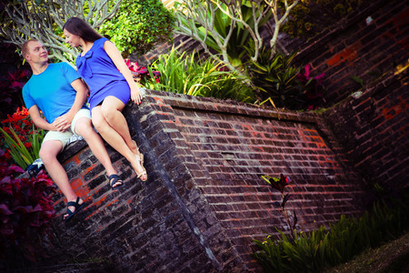 photo of lovers couple at wall near the mystical hotelの写真素材