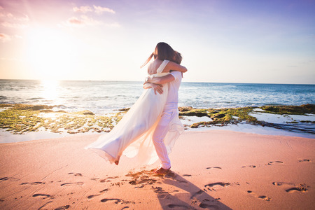 wedding couple just married at the beachの写真素材