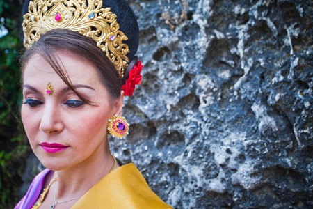 Mature woman dressed in Balinese style for the ceremonyの写真素材