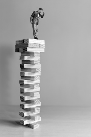 risk manager standing on the top and looking downの写真素材