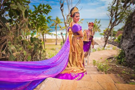 Wedding ceremony of mature couple dressed in Balinese costumeの写真素材