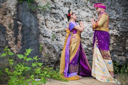 Wedding ceremony of mature couple dressed in Balinese costumeの写真素材