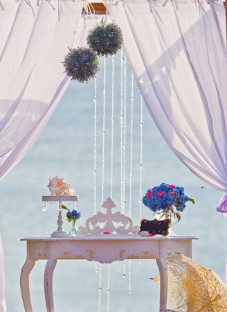 Wedding table with beautiful blue flowers and wedding decorationsの写真素材